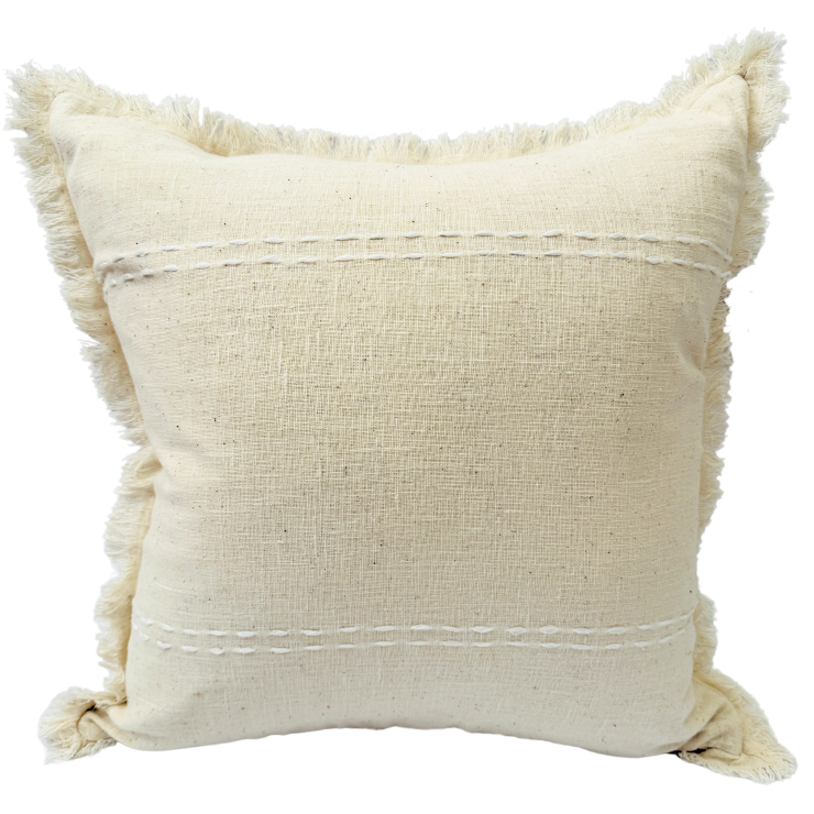 Beige cushion with textured surface and tassels.
