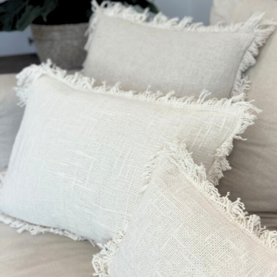 White cushions on a sofa.