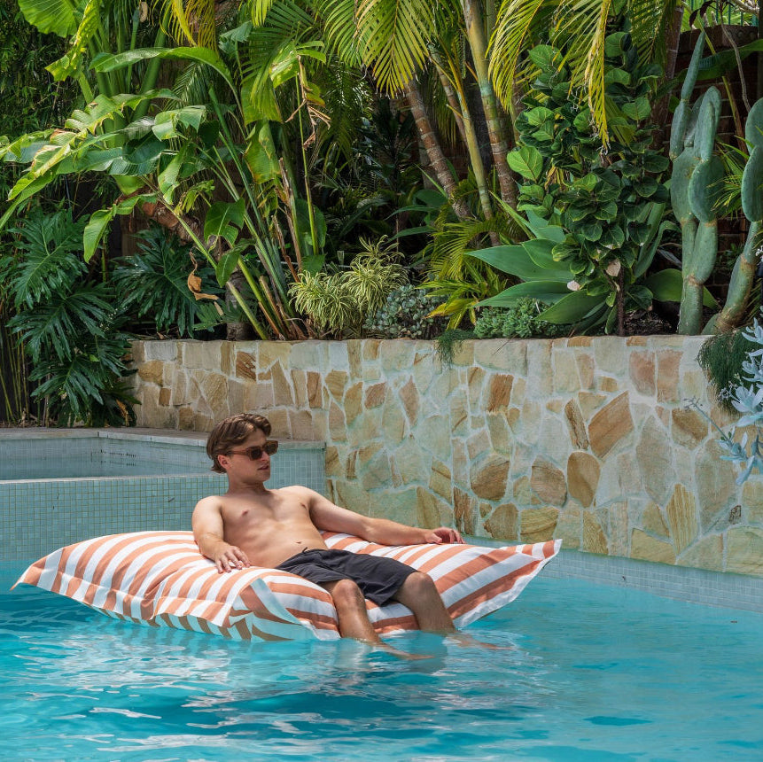 Pool pillow with man.