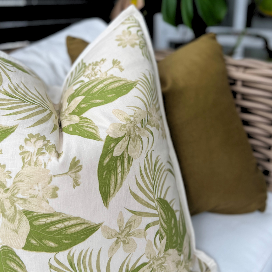 Floral cushion on a sofa.