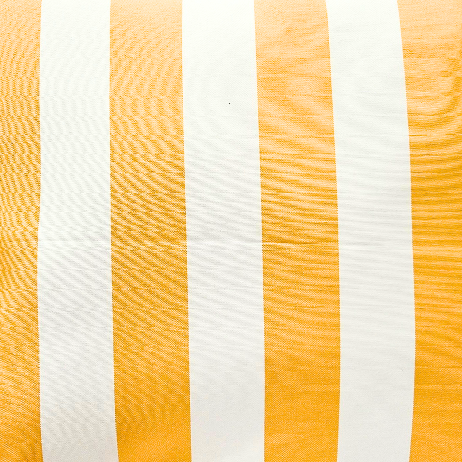 Close-up of a cushion with yellow and white vertical stripes on a white background.