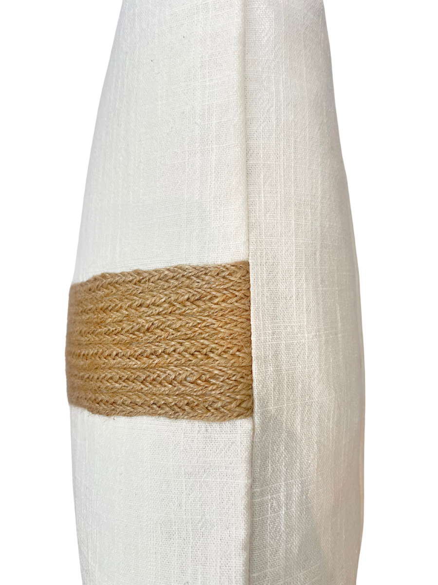 side angle of white linen cushion raffia detail