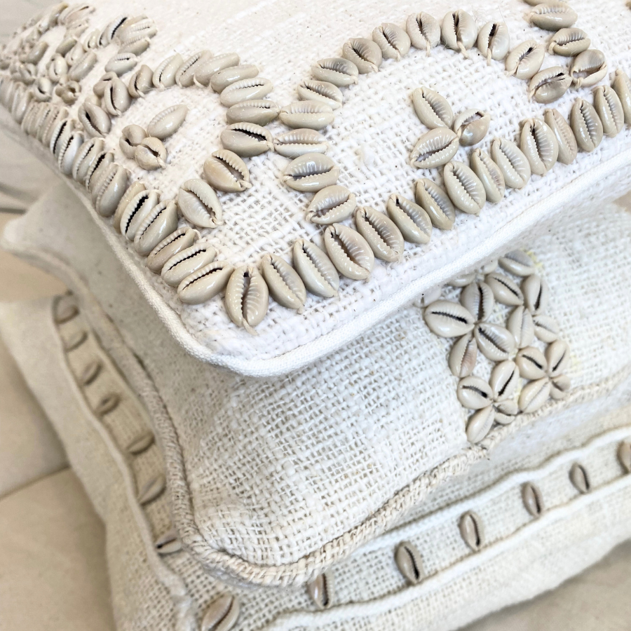 Cushion with shell decor.