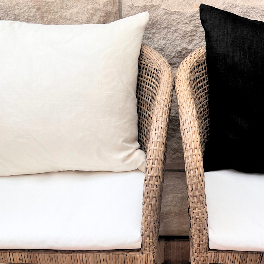 Black and white cushion on a chair. 