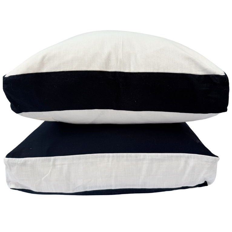 Two cushions with navy and white stripes stacked.