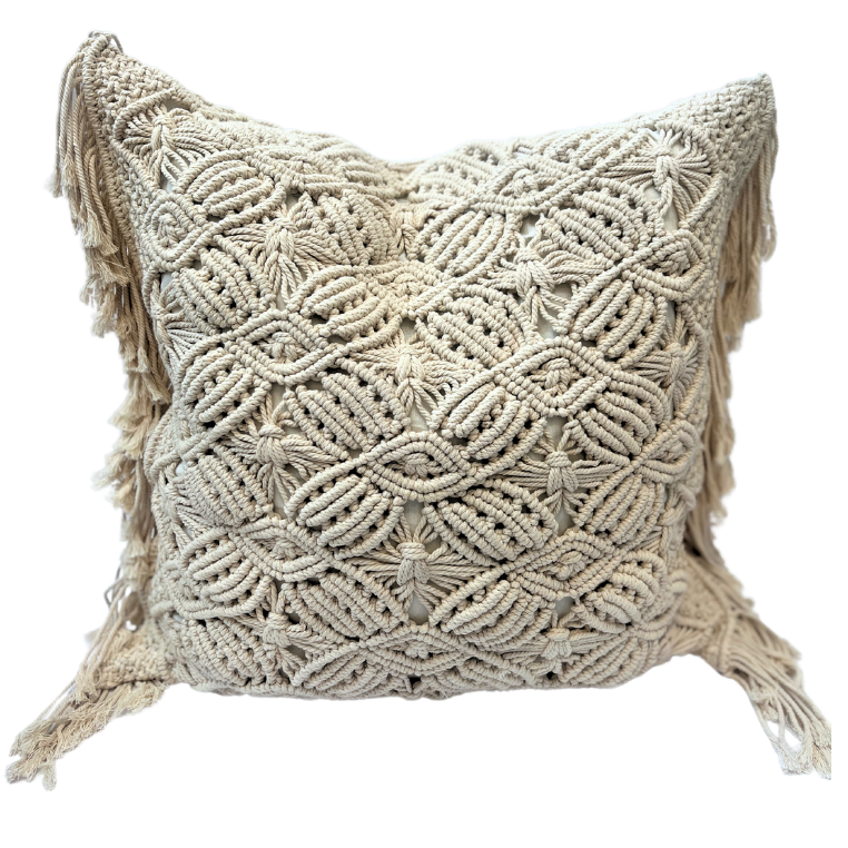 A square-shaped cushion cover with a geometric macrame pattern in beige color, featuring fringed edges.