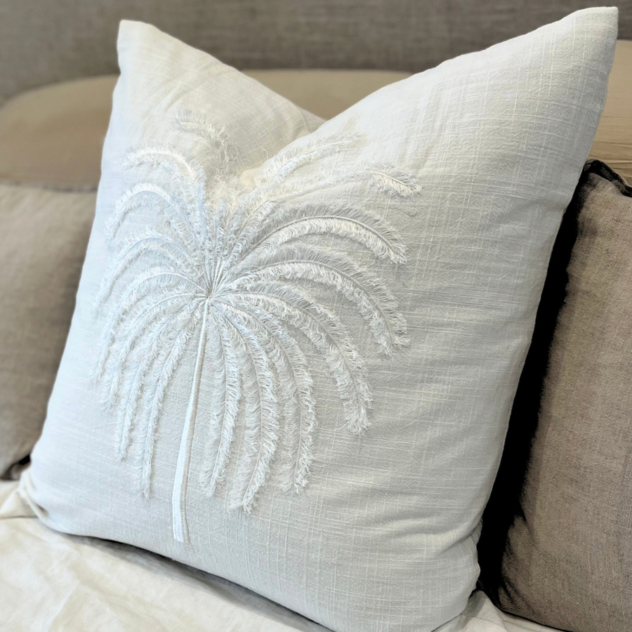 White cushion on a sofa.