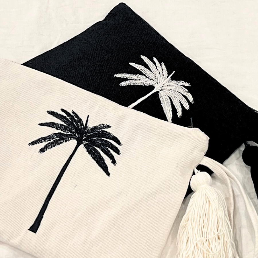Coastal pouch accessory black and white tassel