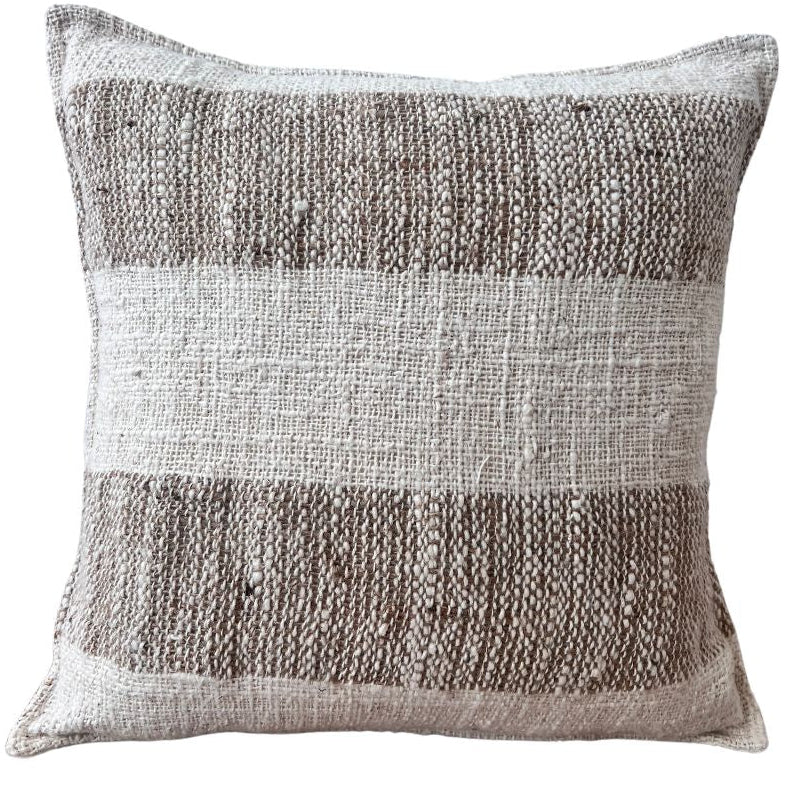 A square-shaped throw cushion with a striped pattern in shades of brown and beige, with a textured cotton front and a linen blend back.