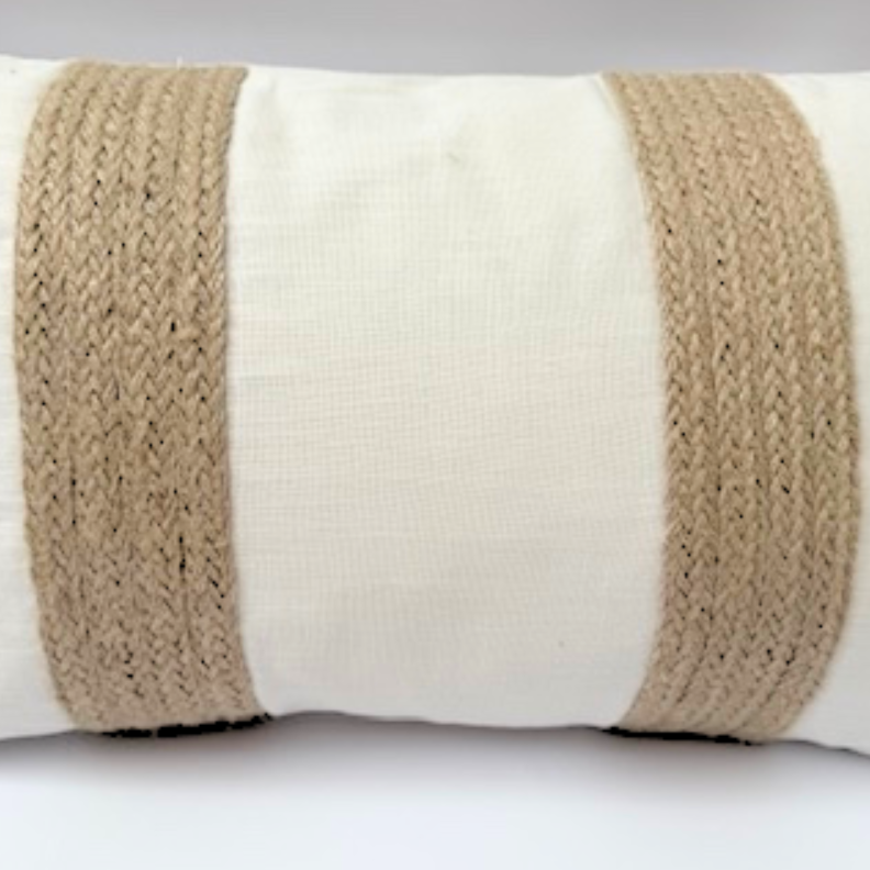 Decorative cushion with a beige woven band on a white background.