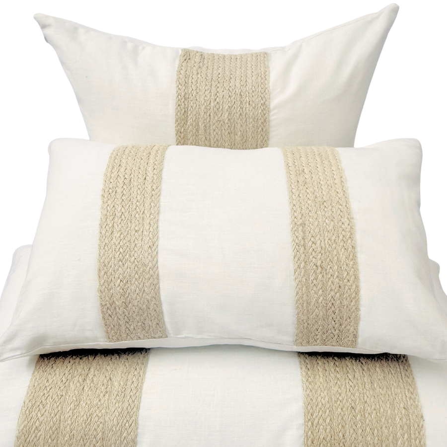 Set of three cushion with beige stripes.