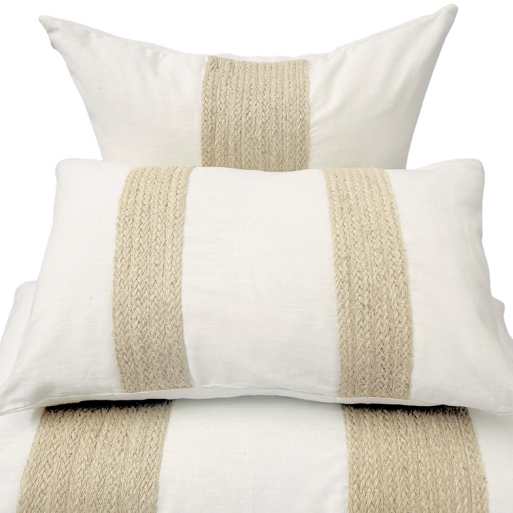 Set of three cushion with beige stripes.