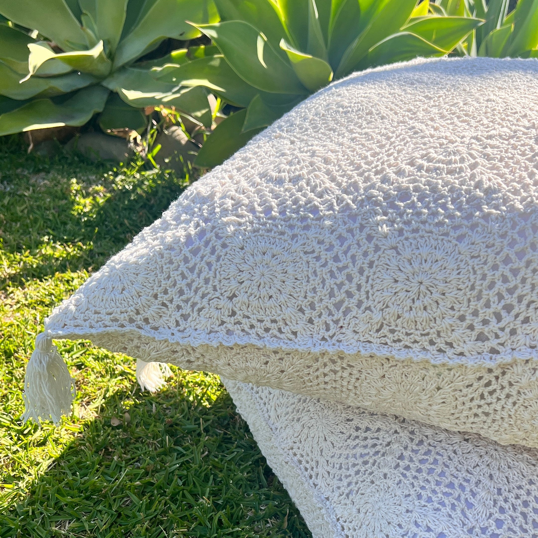 Artistic woven white cushion outdoor.
