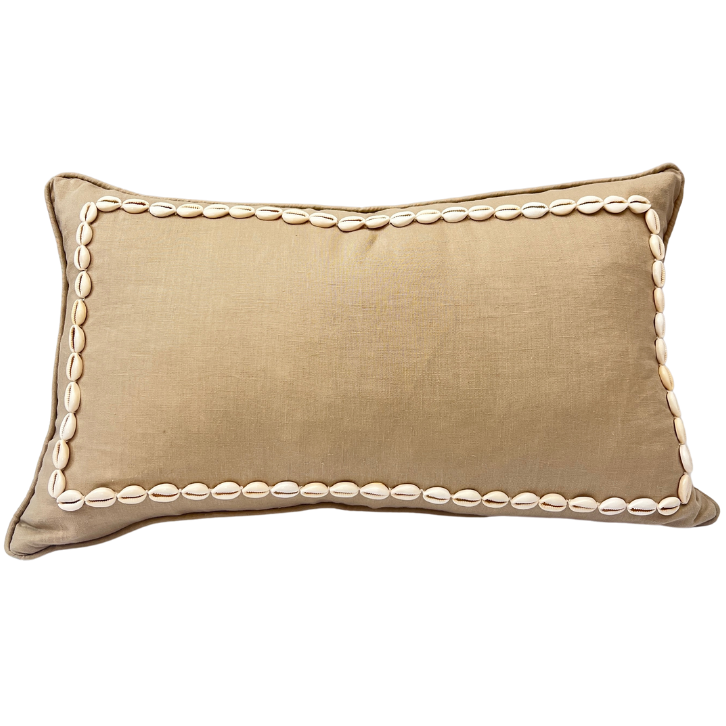 A beige linen cushion with a rectangular pattern made from sewn shells, with a zipper closure.