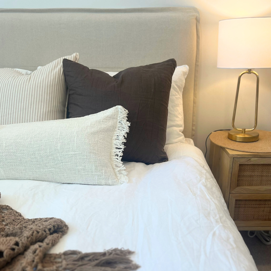 Cushions on a bed.