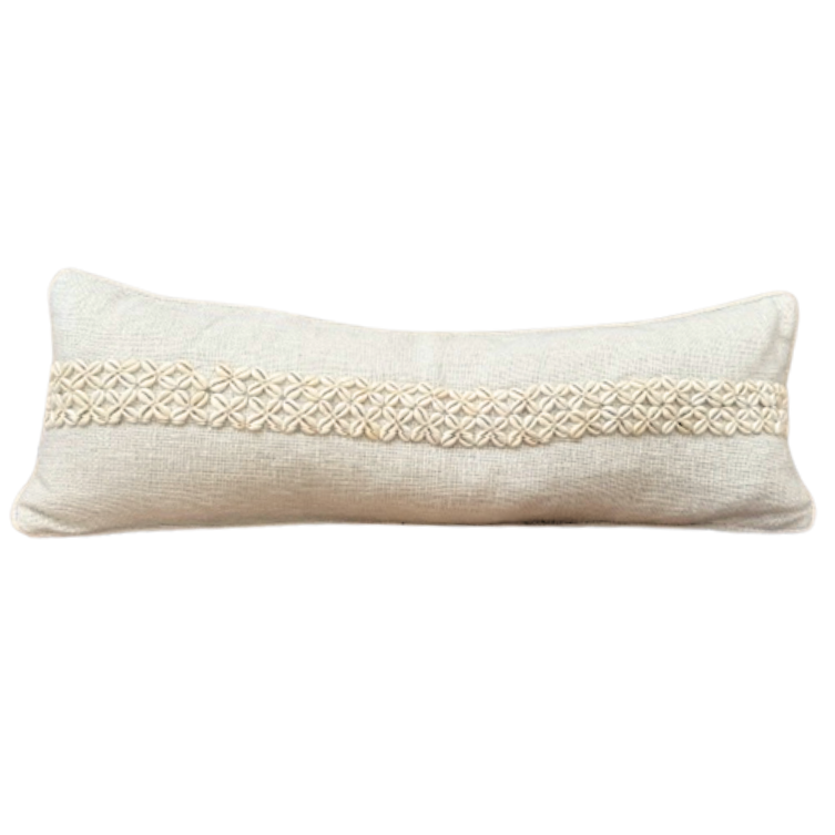 Beige cushion with woven pattern.
