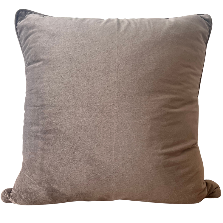 Luxury velvet throw cushion in a mocha color with a smooth texture, designed with invisible zips and piped edges.
