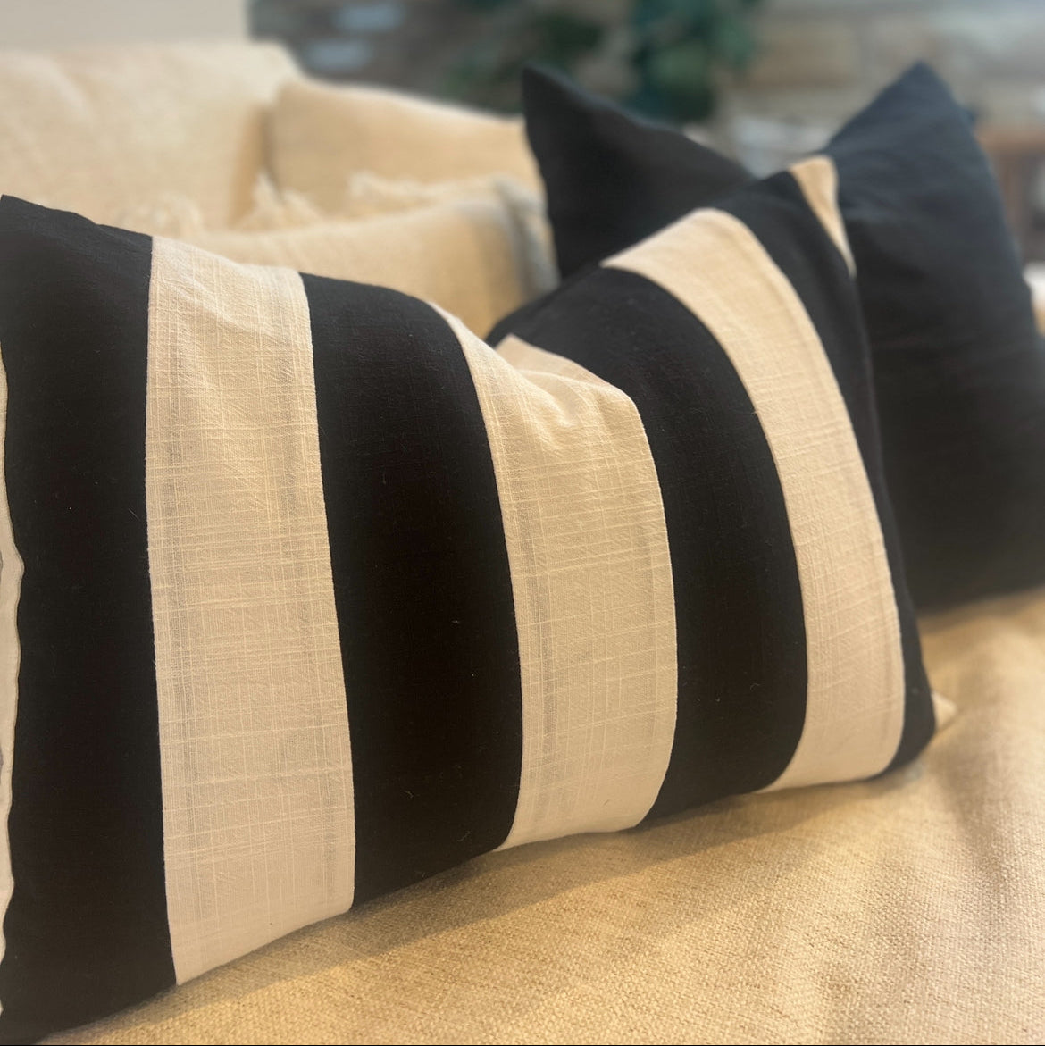 Striped cushions on a sofa.
