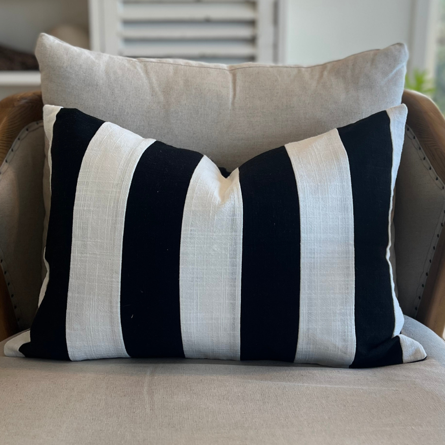 Decorative textured cushion on a sofa.