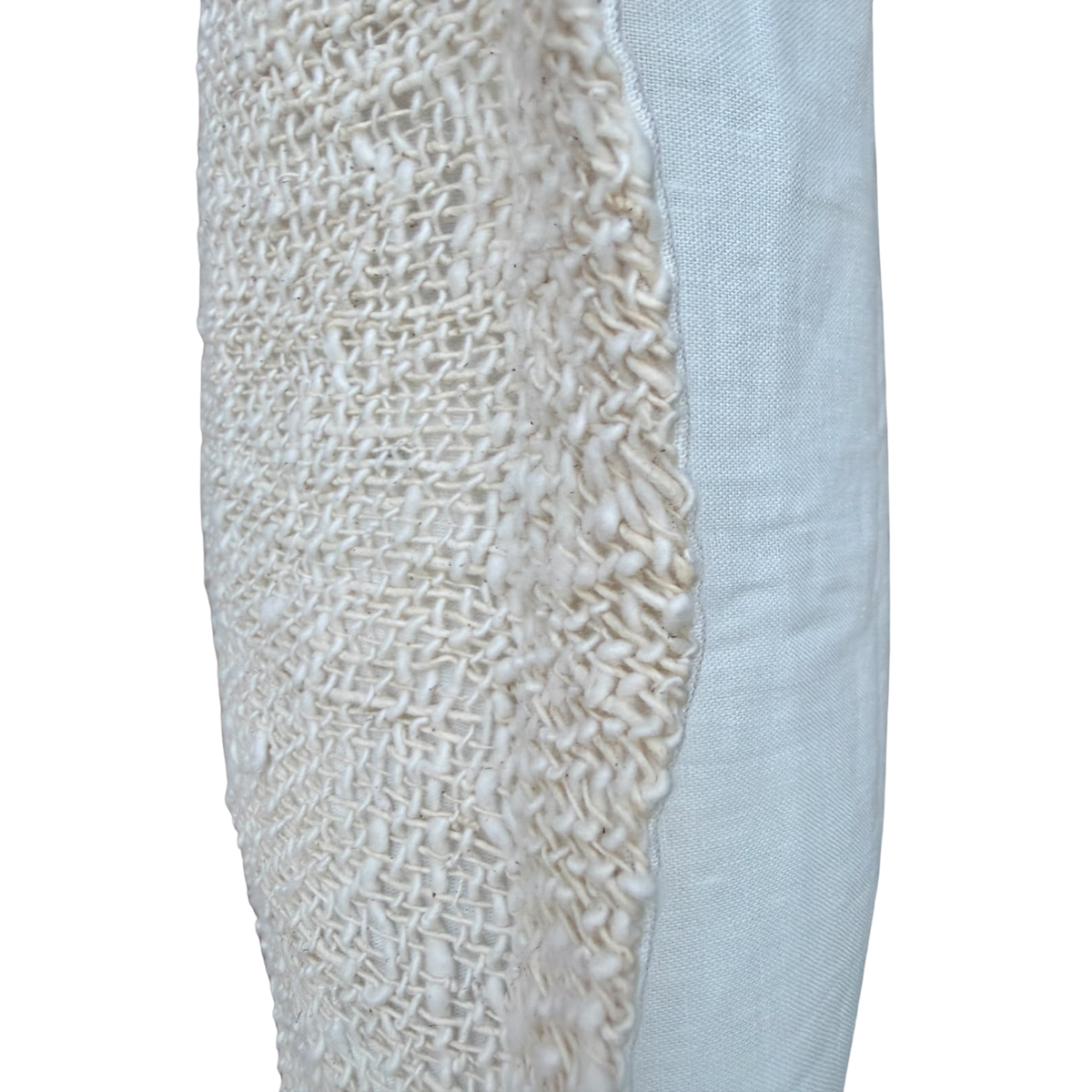Side profile view of a white linen cushion highlighting the textured woven center panel overlay.