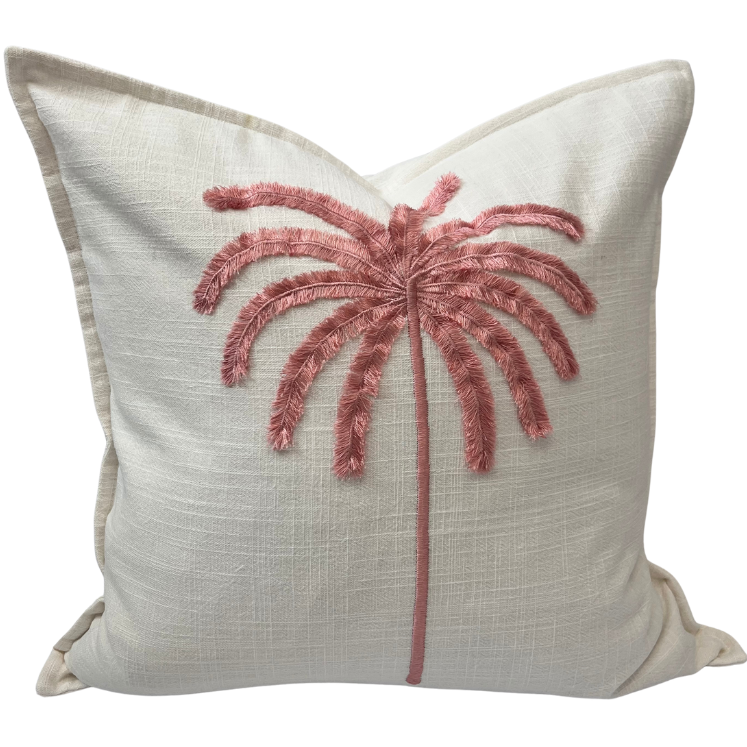 A square-shaped cushion cover with a tufted embroidered palm design in pink on a cream-colored background.