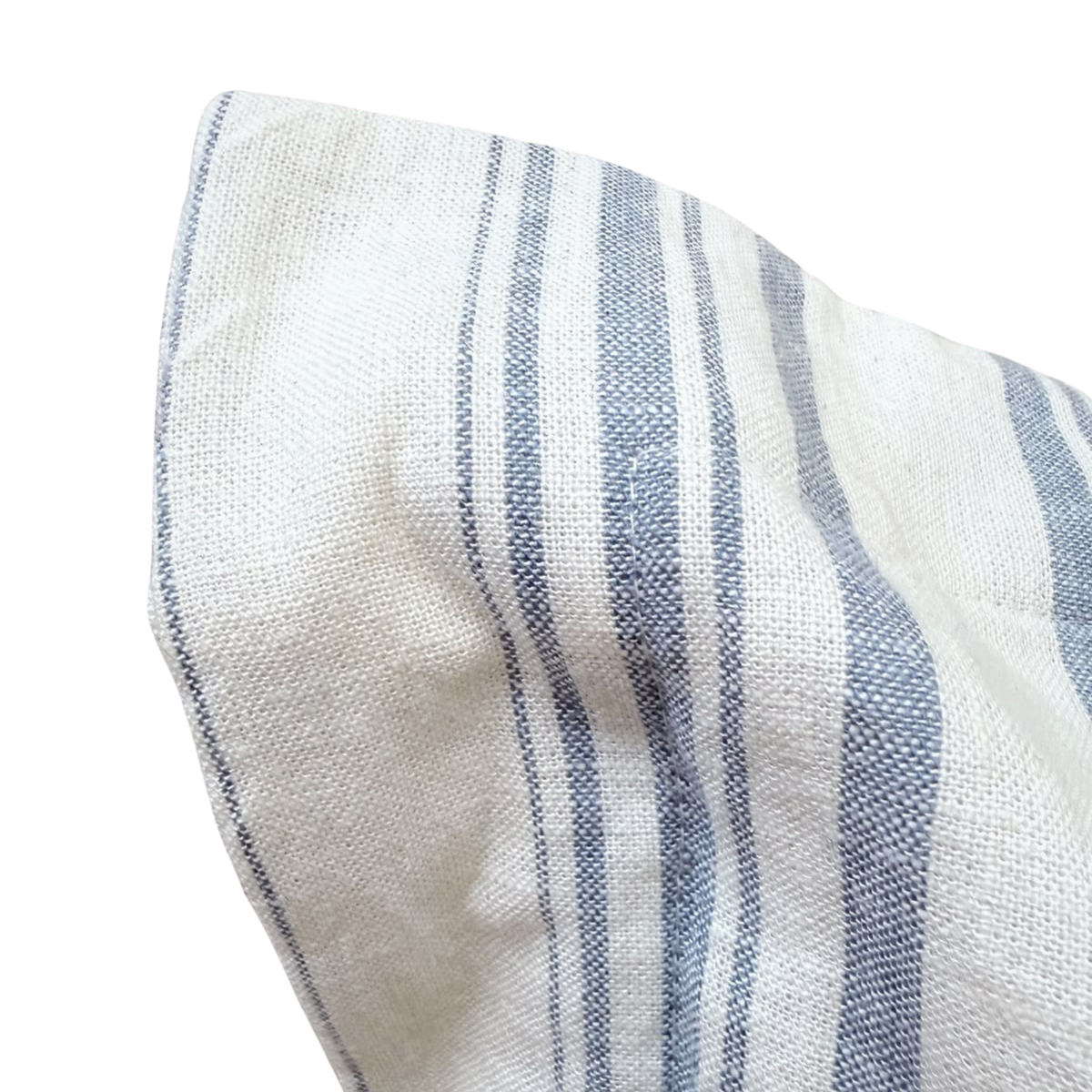 Close-up of stitched flanged corner on a blue and white striped linen pillow cover.