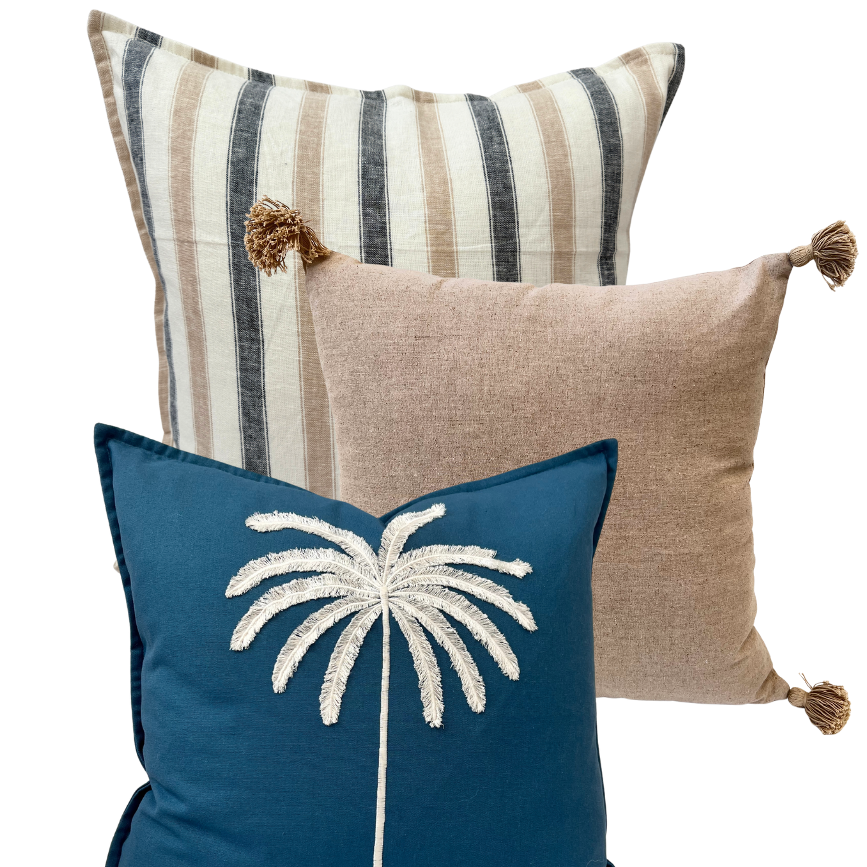Three decorative cushion with a palm tree design.
