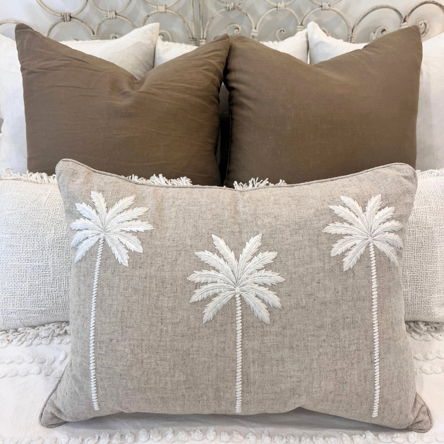 Decorative cushions on a bed.