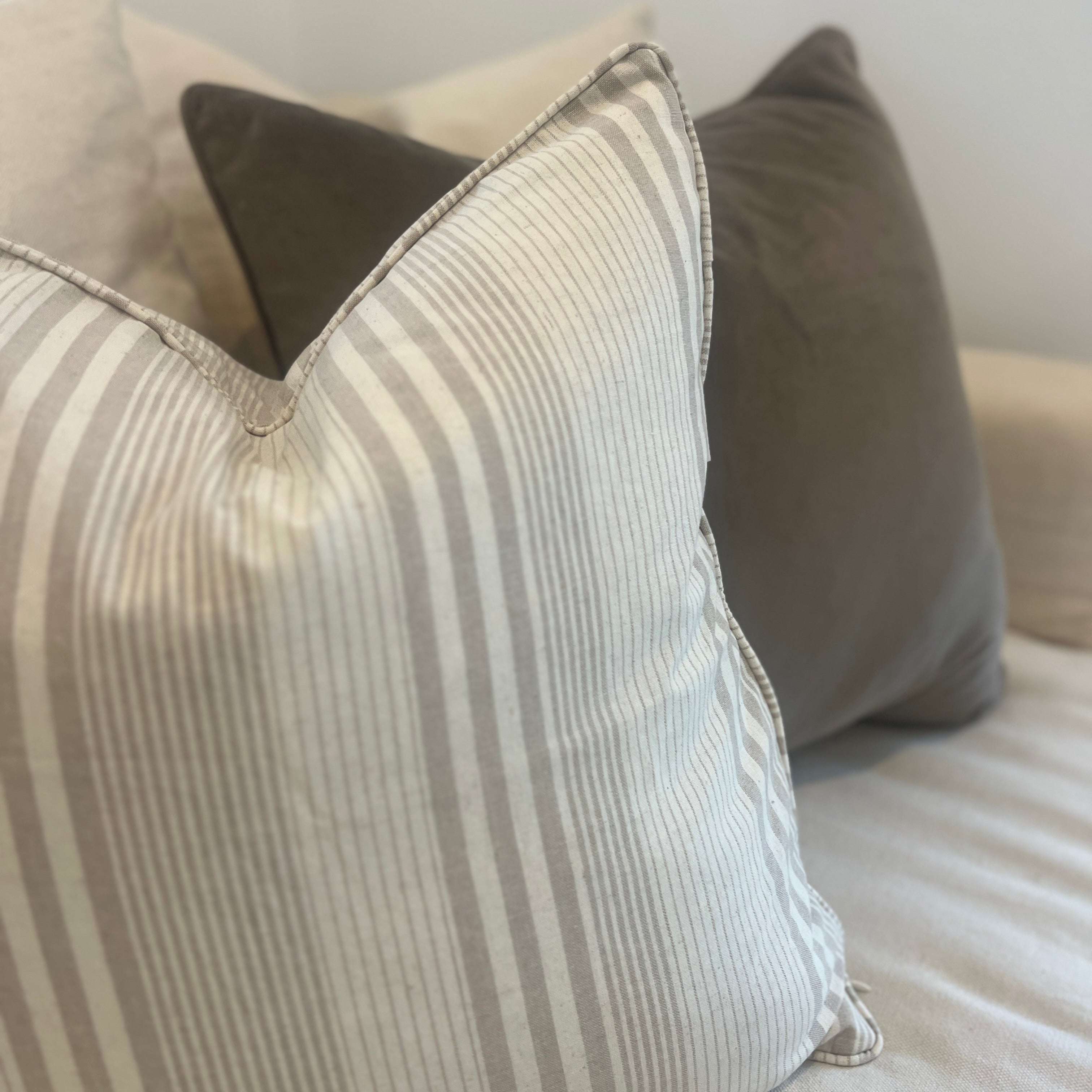 Striped cushion on a sofa.