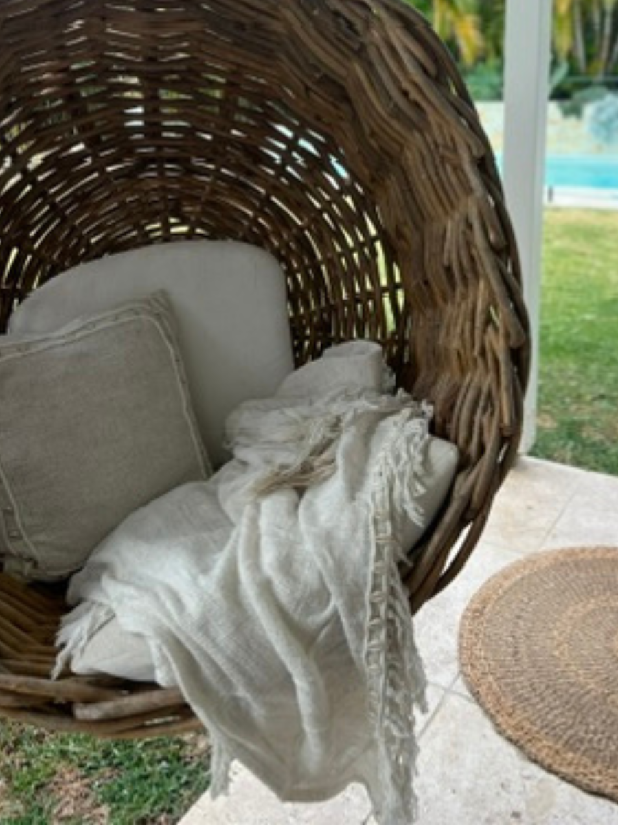 Shell square cushion natural throw in garden